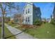 Beautiful two-story home with front porch and manicured lawn in established neighborhood at 121 Warbler Way, Summerville, SC 29483