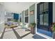 Charming front porch with comfortable seating and potted plants, creating a welcoming entrance at 121 Warbler Way, Summerville, SC 29483