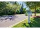 Street view with certified wildlife habitat sign surrounded by trees and greenery in The Ponds at 121 Warbler Way, Summerville, SC 29483
