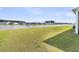 Expansive backyard with a well-maintained lawn and a picturesque lake view at 1213 Locals St, Summerville, SC 29485