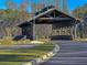 A charming covered bridge welcomes residents and guests at 1213 Locals St, Summerville, SC 29485
