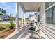 Inviting front porch with comfortable chairs and a serene neighborhood view at 1213 Locals St, Summerville, SC 29485