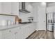 Modern kitchen showcasing white cabinets, subway tile backsplash, and stainless steel appliances for a clean, stylish aesthetic at 1213 Locals St, Summerville, SC 29485