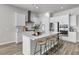 Modern kitchen with a central island, stainless steel appliances, and stylish pendant lighting, perfect for entertaining at 1213 Locals St, Summerville, SC 29485
