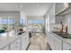 Bright, open kitchen featuring white cabinets, a central island, and an adjacent dining area for easy entertaining and Gathering meals at 1213 Locals St, Summerville, SC 29485