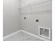 Functional laundry area with marble tile, a wire shelf, and essential hookups for appliances at 1213 Locals St, Summerville, SC 29485