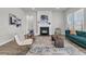 Cozy living room with a fireplace, modern furniture, and stylish decor, creating a welcoming atmosphere at 1213 Locals St, Summerville, SC 29485
