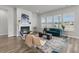 Bright living room with fireplace, modern decor, and lots of natural light at 1213 Locals St, Summerville, SC 29485