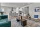 Open-concept living room showcasing seamless transition to kitchen, highlighted by contemporary furnishings and stylish decor at 1213 Locals St, Summerville, SC 29485
