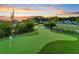 A beautifully manicured putting green offers residents a relaxing recreational amenity at sunset at 1213 Locals St, Summerville, SC 29485
