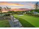A tranquil bench offers a spot to relax and enjoy a game on the putting green at 1213 Locals St, Summerville, SC 29485