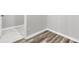 Features neutral walls, wood flooring that meets white marble tile and white baseboards at 1213 Locals St, Summerville, SC 29485