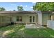 Backyard with concrete patio, grassy lawn, back door, and privacy fence at 122 Stewart Pl, Summerville, SC 29485
