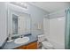 Cozy bathroom with a shower and tub combination, blue walls, and an oak cabinet at 122 Stewart Pl, Summerville, SC 29485