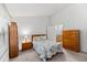 Bright bedroom with a beach-themed comforter, wooden furniture, and ample natural light at 122 Stewart Pl, Summerville, SC 29485
