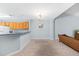 Open-concept living area with wood cabinets, seating and neutral paint at 122 Stewart Pl, Summerville, SC 29485