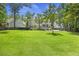 Backyard with a large green space and patio with a view of the home's rear exterior at 1228 Walleye Cor, Charleston, SC 29414