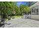 Enjoy this home's large backyard with a basketball court and stairs to a screened-in back porch at 1228 Walleye Cor, Charleston, SC 29414
