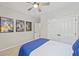 Quaint bedroom decor featuring a ceiling fan, and Back to the Future movie posters hanging on the wall at 1228 Walleye Cor, Charleston, SC 29414
