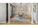 Elegant dining room with hardwood floors, modern chandelier, and large windows, perfect for gatherings and meals at 1228 Walleye Cor, Charleston, SC 29414