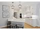 Stylish kitchen with white cabinets, marble countertops, breakfast bar, and open layout, perfect for cooking and entertaining at 1228 Walleye Cor, Charleston, SC 29414