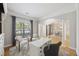 Cozy living room area with hardwood floors, neutral decor, and bright windows, offering a comfortable and inviting space at 1228 Walleye Cor, Charleston, SC 29414