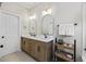 Stylish main bathroom with dual sinks, modern vanity, and decorative mirrors at 1228 Walleye Cor, Charleston, SC 29414