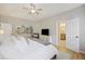 Spacious main bedroom with ceiling fan, walk-in closet, and ensuite bathroom at 1228 Walleye Cor, Charleston, SC 29414