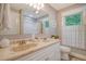 Bathroom featuring a double sink vanity, a large mirror, and a shower/tub at 125 Sumners Aly, Summerville, SC 29485