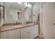 Bathroom featuring a double sink vanity with granite countertop and white cabinetry at 125 Sumners Aly, Summerville, SC 29485
