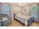 Cozy bedroom with blue accents, comfortable chair, and natural light at 125 Sumners Aly, Summerville, SC 29485