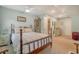 Bright bedroom features a wooden bed frame, and neutral walls at 125 Sumners Aly, Summerville, SC 29485