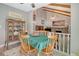 Charming dining room with vaulted ceilings, exposed wooden beams, stone fireplace, and wood table with seating for six at 125 Sumners Aly, Summerville, SC 29485