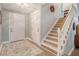 Inviting entryway featuring staircase and neutral walls, creating a warm and welcoming atmosphere at 125 Sumners Aly, Summerville, SC 29485