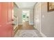 Bright foyer with hardwood floors, neutral walls, and a glimpse into the modern kitchen beyond at 125 Sumners Aly, Summerville, SC 29485
