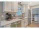 Well-lit kitchen area with white cabinets and stainless-steel appliances at 125 Sumners Aly, Summerville, SC 29485
