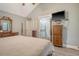 Well-lit main bedroom features coordinated furniture and ensuite bathroom access at 125 Sumners Aly, Summerville, SC 29485