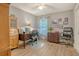 Bright office space with wood floors, a ceiling fan, and a large window offering natural light at 125 Sumners Aly, Summerville, SC 29485