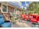 Inviting patio with comfortable seating, perfect for outdoor relaxation and entertaining with a brick exterior wall at 125 Sumners Aly, Summerville, SC 29485