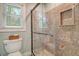Walk-in shower with glass door, granite tile, and built-in niche at 125 Sumners Aly, Summerville, SC 29485