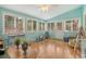 Bright sunroom with many windows, exercise equipment, neutral tones, and access to the backyard at 125 Sumners Aly, Summerville, SC 29485