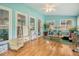 Bright sunroom with hardwood floors, light blue walls, and multiple windows at 125 Sumners Aly, Summerville, SC 29485