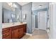 Bathroom featuring a cherry wood vanity, white countertop, and tiled floors at 129 Saluda Dr, Moncks Corner, SC 29461