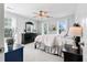 Bright bedroom with neutral carpet, black furnishings, and large windows for natural light at 129 Saluda Dr, Moncks Corner, SC 29461