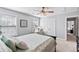 Bright bedroom featuring a work desk, ceiling fan, and black furniture at 129 Saluda Dr, Moncks Corner, SC 29461