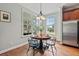 Charming breakfast nook with wood floors, natural light, and seating for four at 129 Saluda Dr, Moncks Corner, SC 29461