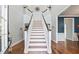 Bright foyer featuring hardwood floors, a stairway, and neutral gray walls at 129 Saluda Dr, Moncks Corner, SC 29461