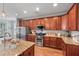 Bright kitchen with stainless appliances, granite counters, and ample cabinet space at 129 Saluda Dr, Moncks Corner, SC 29461