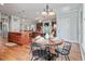 Open-concept kitchen with an eat-in table flowing into the adjacent living area at 129 Saluda Dr, Moncks Corner, SC 29461