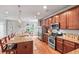 Modern kitchen with stainless steel appliances, granite countertops, and a spacious island at 129 Saluda Dr, Moncks Corner, SC 29461